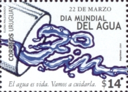 Vaso de agua que está inclinado hacia abajo, el agua cae y forma la palabra 