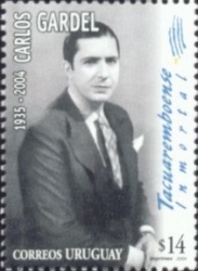 Foto de Gardel, con leyenda vertical: Tacuaremboense Inmoral y bandera de Uruguay dibujada.